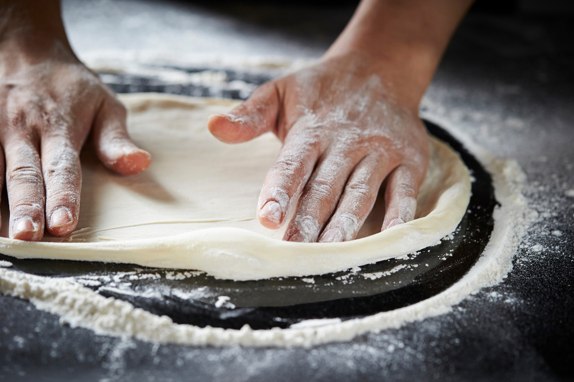 Kneading pizza dough